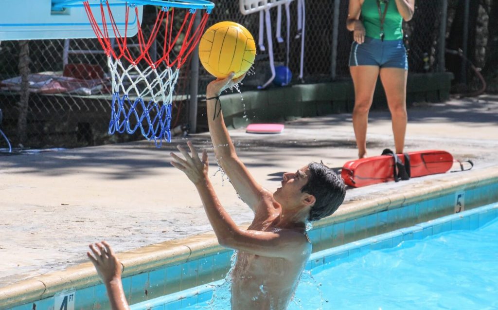 Boy playing water basketball